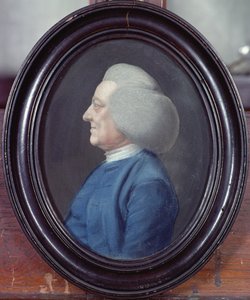 Portret van een man met een blauwe jas